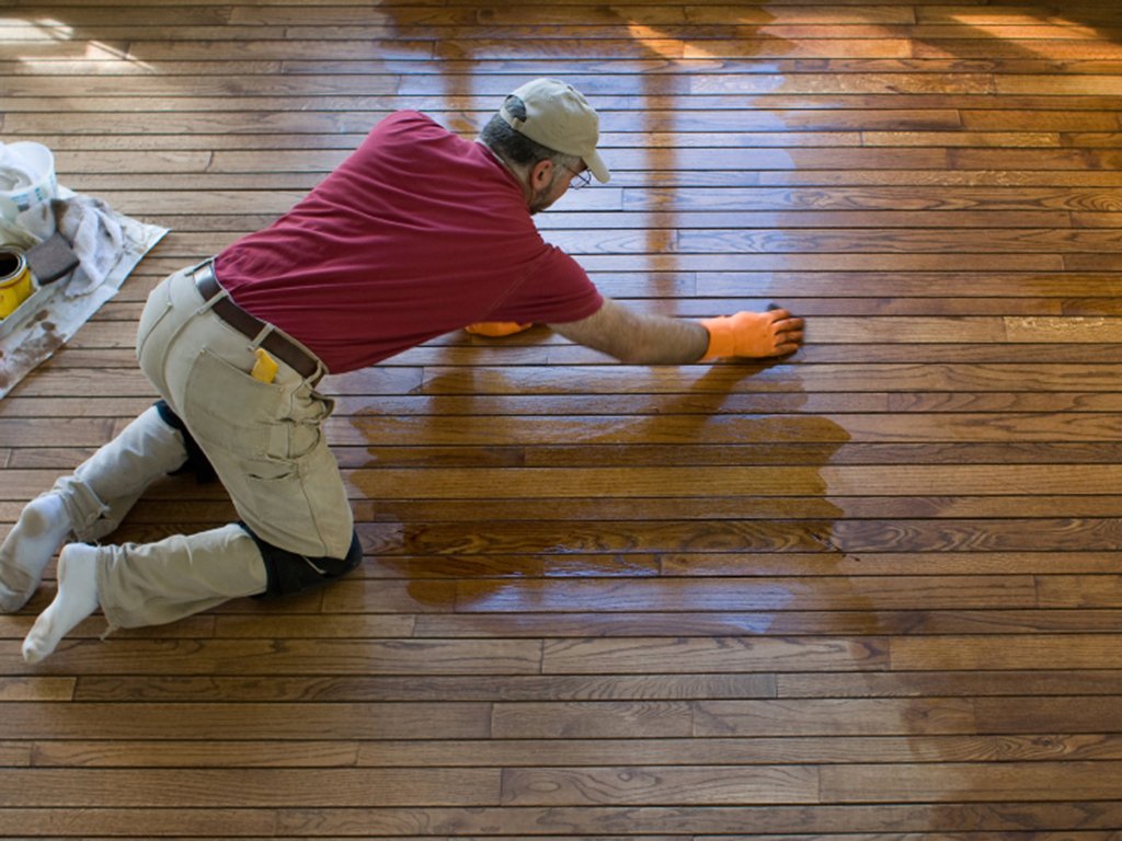 an Independence floor refinisher hard at work updating a wood floor.