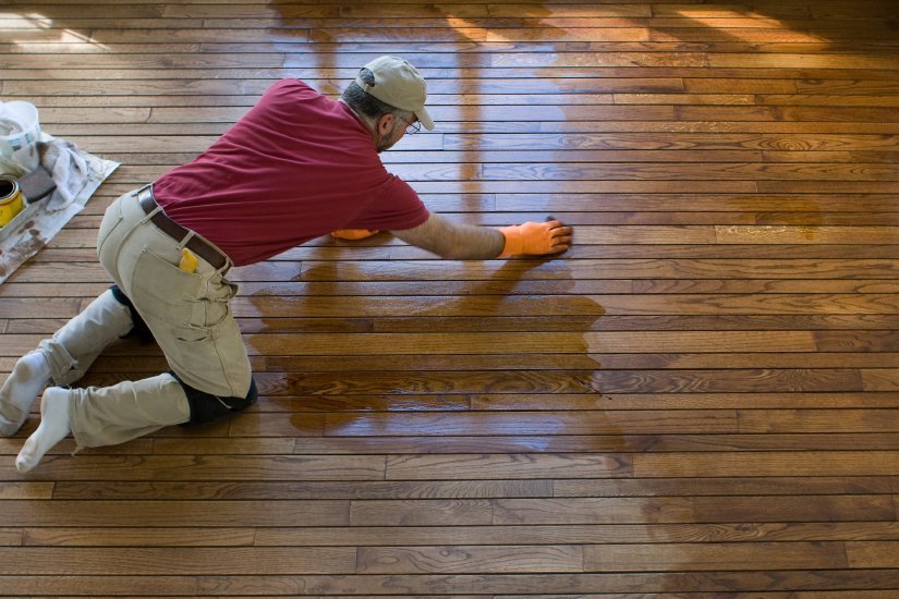 a fabulous floors technician refinishing a floor